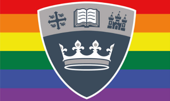 The 33Ƶ shield in front of the LGBTQ+ flag